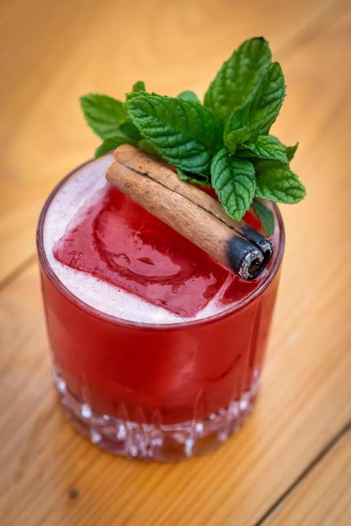 a drink with a cinnamon stick on top of it at Hilton Garden Inn Phoenix Downtown in Phoenix