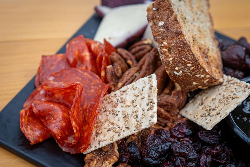 a plate of food with different types of bread and pretzels at Hilton Garden Inn Phoenix Downtown in Phoenix