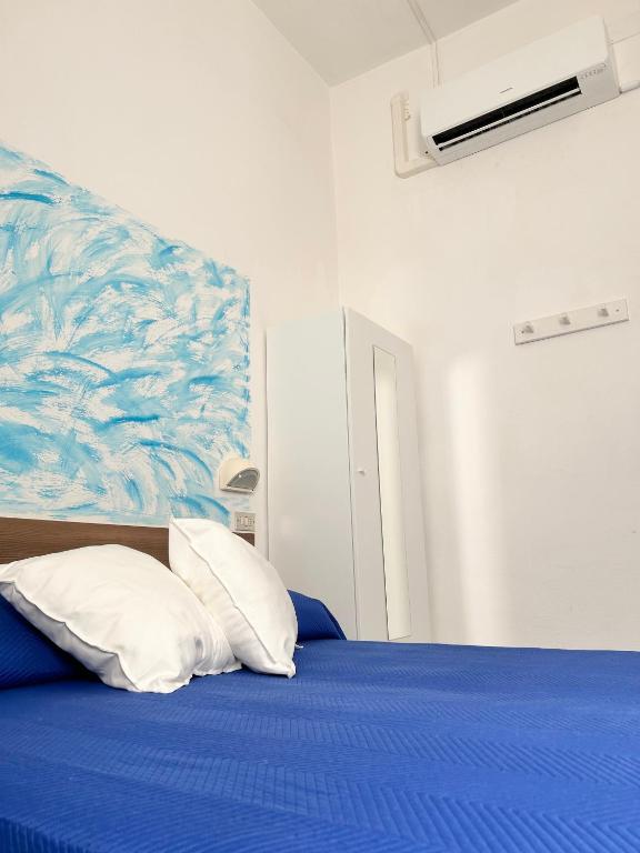 Postel nebo postele na pokoji v ubytování Hotel Bartolini