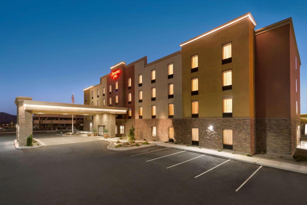 a hotel with a parking lot in front of it at Hampton Inn by Hilton Elko Nevada in Elko