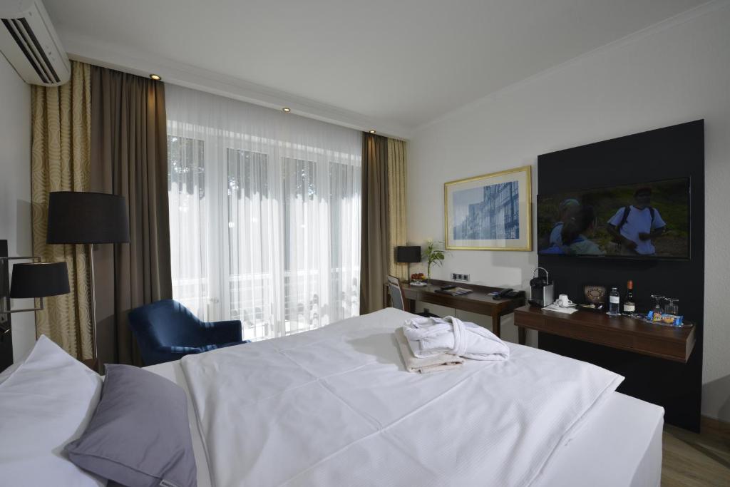 TV a/nebo společenská místnost v ubytování Hotel Caroline Mathilde