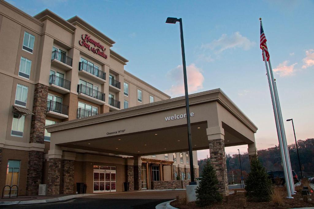 a hotel with an american flag in front of it at Hampton Inn & Suites Boone, Nc in Boone