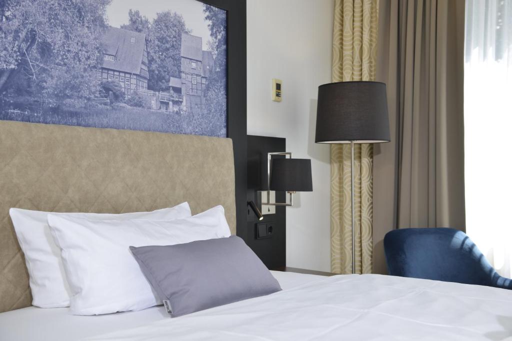 Postel nebo postele na pokoji v ubytování Hotel Caroline Mathilde