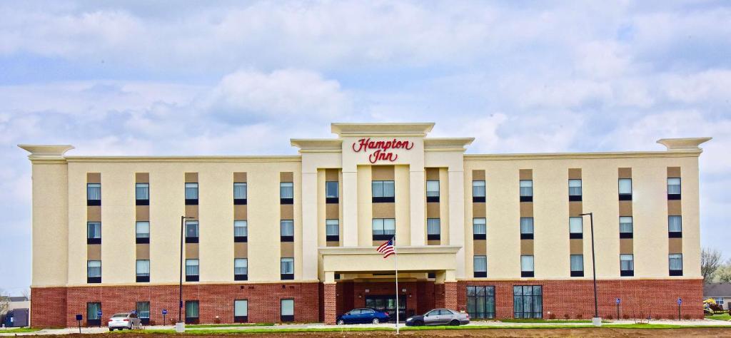 a building with a sign on top of it at Hampton Inn By Hilton Kirksville MO in Kirksville