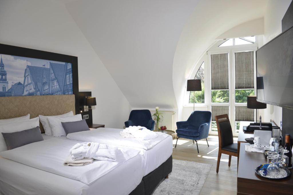 Postel nebo postele na pokoji v ubytování Hotel Caroline Mathilde