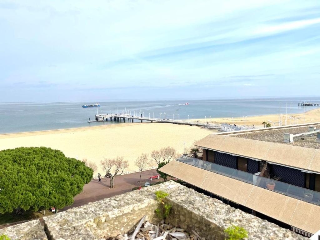 a view of a beach and a pier at Apartment Claire-4 by Interhome in Arcachon