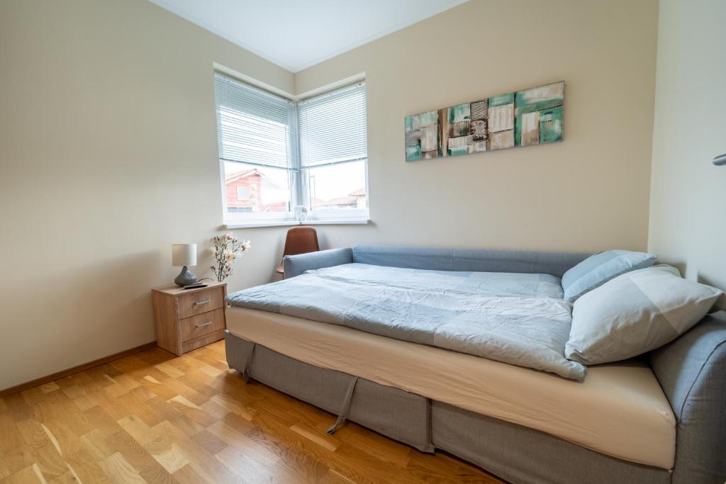 A bed or beds in a room at ABG House Ecser