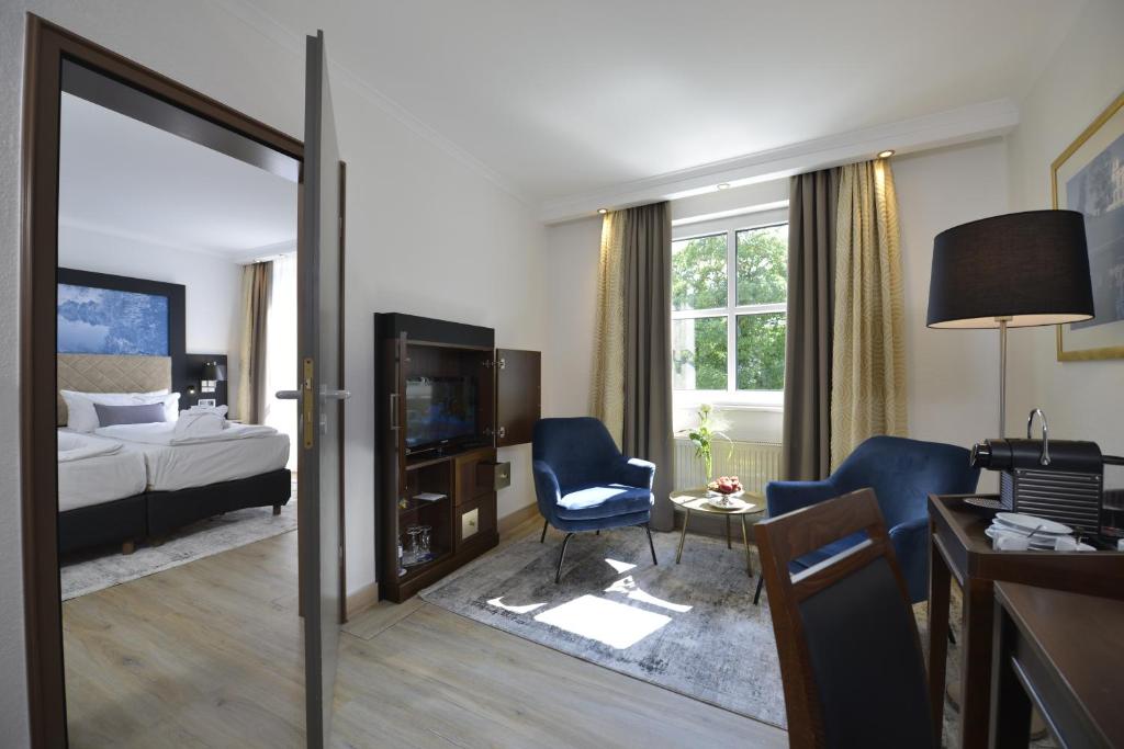 Postel nebo postele na pokoji v ubytování Hotel Caroline Mathilde