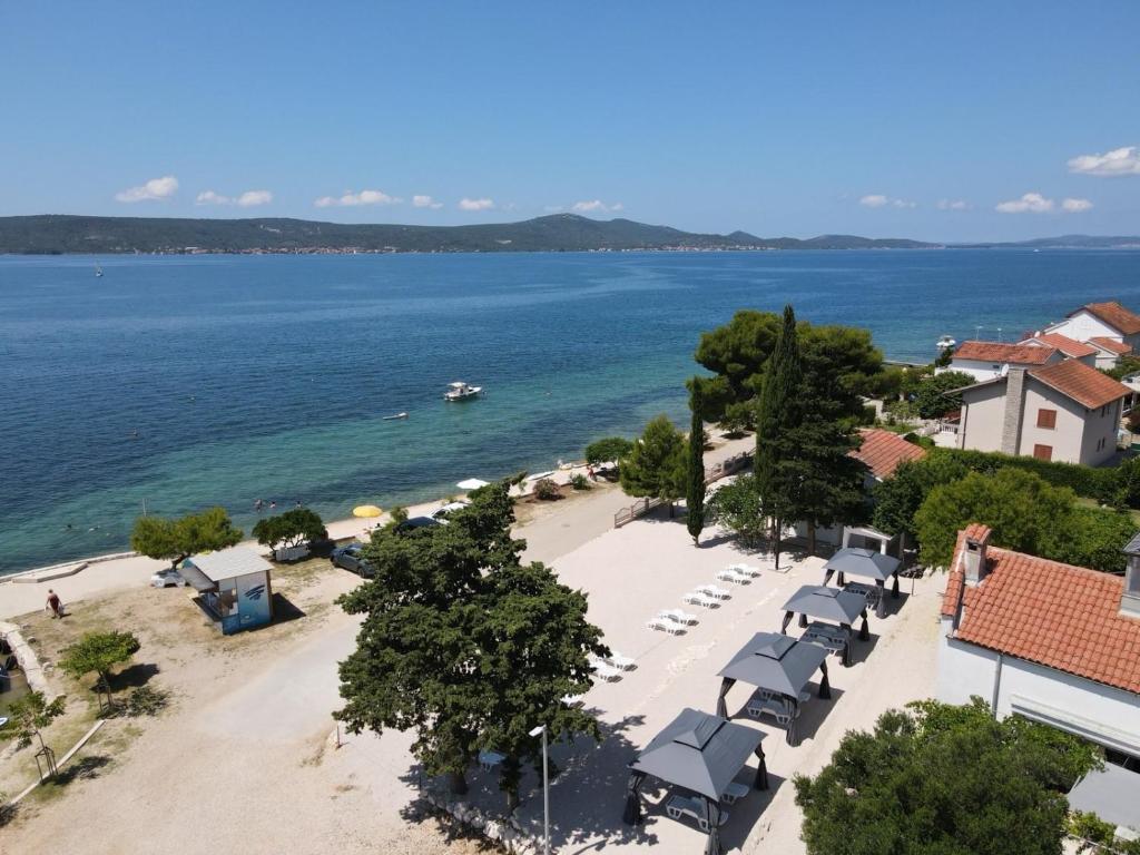 an aerial view of a beach and the ocean at 5 meters FROM THE SEA with private beach - 70m2 Colibri Sunset Apartments in Sveti Petar