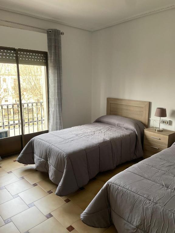 Posteľ alebo postele v izbe v ubytovaní Hotel-Restaurante la Loma