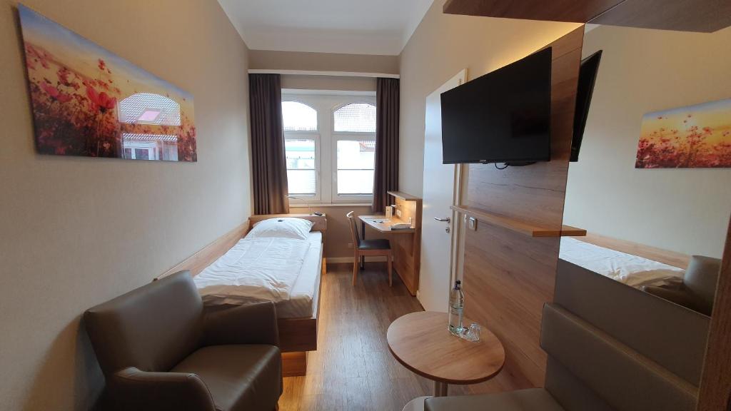 TV a/nebo společenská místnost v ubytování Hotel An der Altstadt