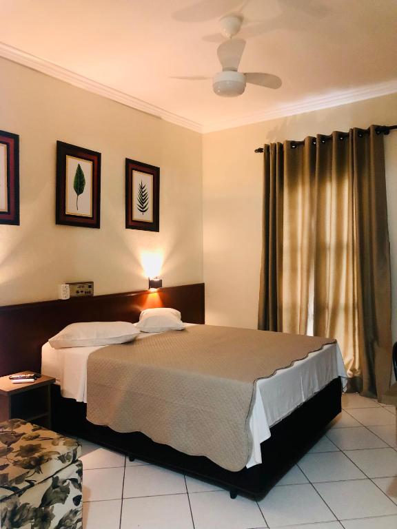 Postel nebo postele na pokoji v ubytování Hotel de Minas