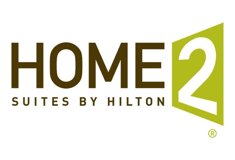 a logo for the home suites by hilton at Home2 Suites By Hilton Owatonna in Owatonna