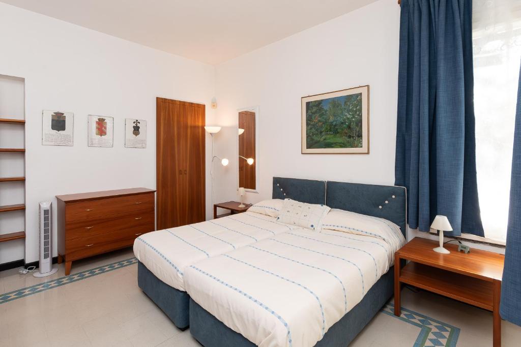 Postel nebo postele na pokoji v ubytování Villa Nettuno- Bluchalet