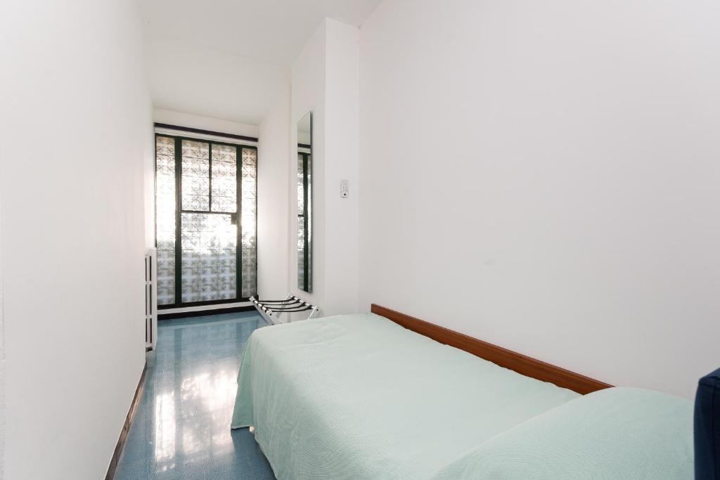 Postel nebo postele na pokoji v ubytování Villa Nettuno- Bluchalet