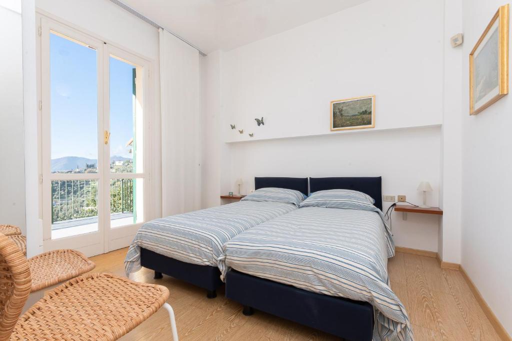 Postel nebo postele na pokoji v ubytování Villa Nettuno- Bluchalet