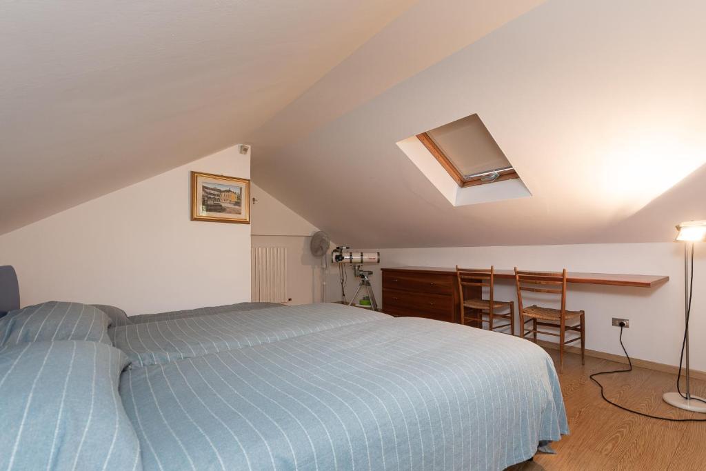 Postel nebo postele na pokoji v ubytování Villa Nettuno- Bluchalet
