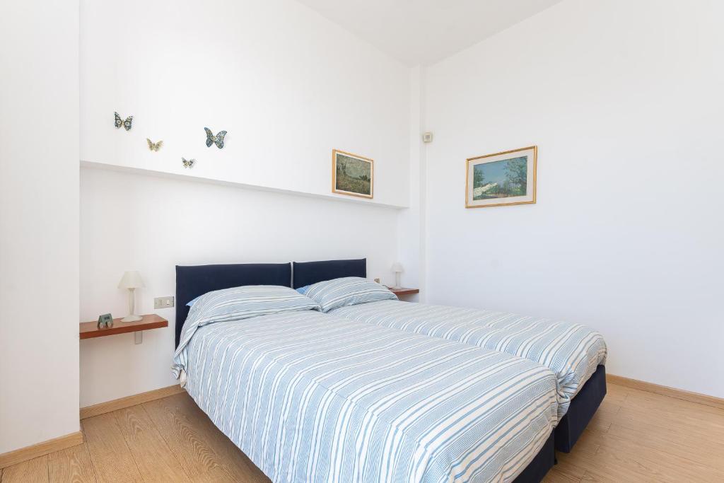 Postel nebo postele na pokoji v ubytování Villa Nettuno- Bluchalet