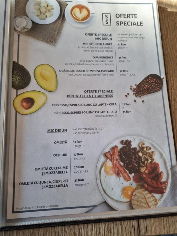 a menu of breakfast foods on a table at Garage studio in Bistriţa