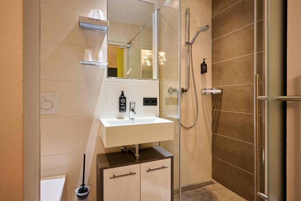 Kúpeľňa v ubytovaní Boutique House happYellow Saalbach, inkl JokerCard