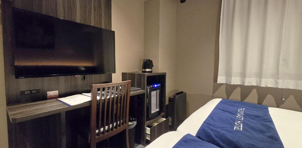 Postel nebo postele na pokoji v ubytování Dynasty Hotel & Resort Osaka
