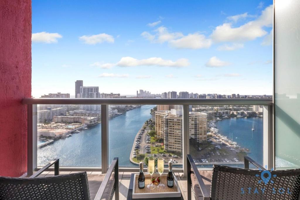 a view of a river from a balcony with chairs at Upper studio Balcony Pool Gym - Near Beach in Hallandale Beach