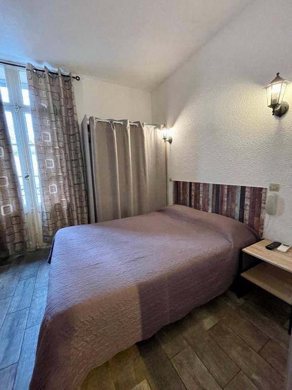 Postel nebo postele na pokoji v ubytování Hotel Alexander