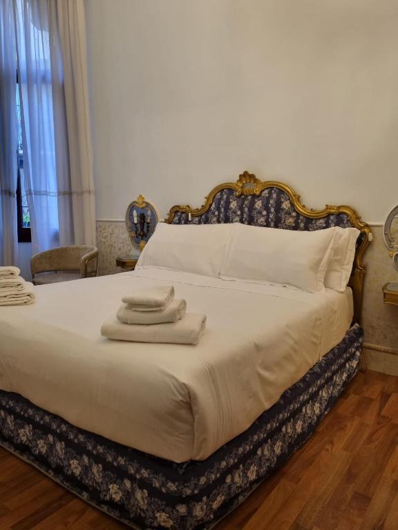 Postel nebo postele na pokoji v ubytování Casa Alla Fenice