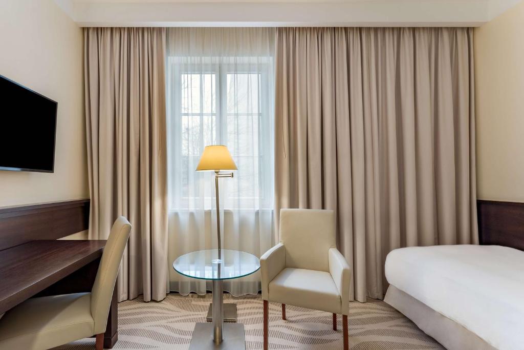 Postel nebo postele na pokoji v ubytování Radisson Blu Hotel, Gdańsk