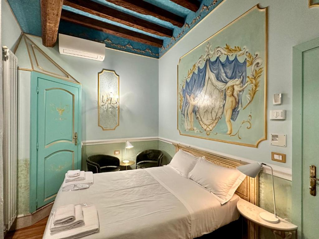 Postel nebo postele na pokoji v ubytování Casa Alla Fenice