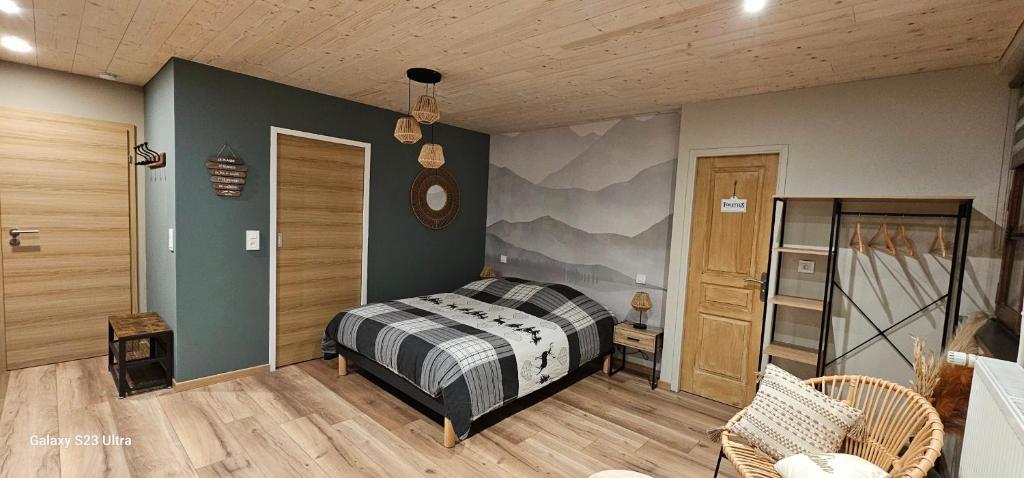a bedroom with a bed in a room at Studio Au coeur du Val Meublé de tourisme 4 étoiles in Le Valdahon