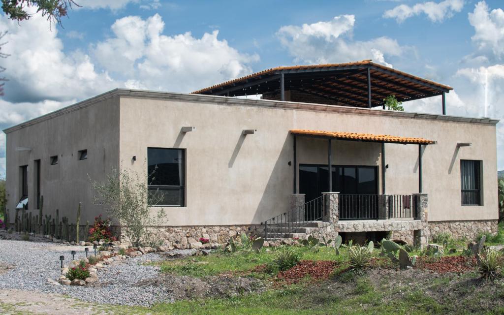 a small building with a porch on top of it at Naakary Home in San Miguel de Allende