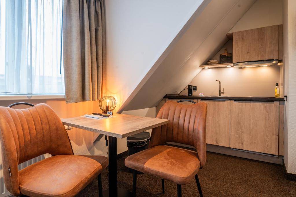 Kuchyň nebo kuchyňský kout v ubytování Huis 8 Studio's