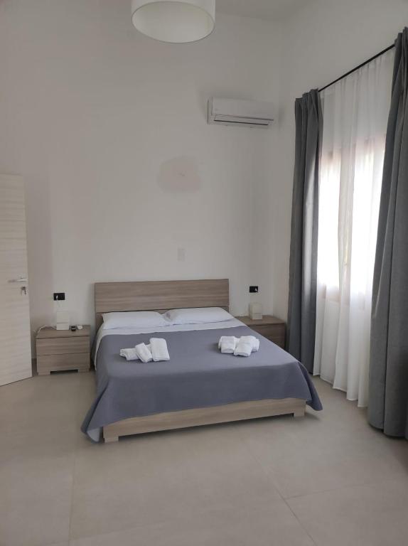 Postel nebo postele na pokoji v ubytování Villa Rita Apartament & Rooms