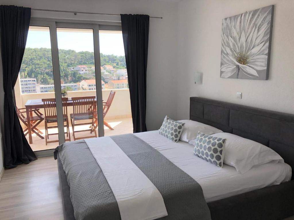 Postel nebo postele na pokoji v ubytování Apartments Antonia