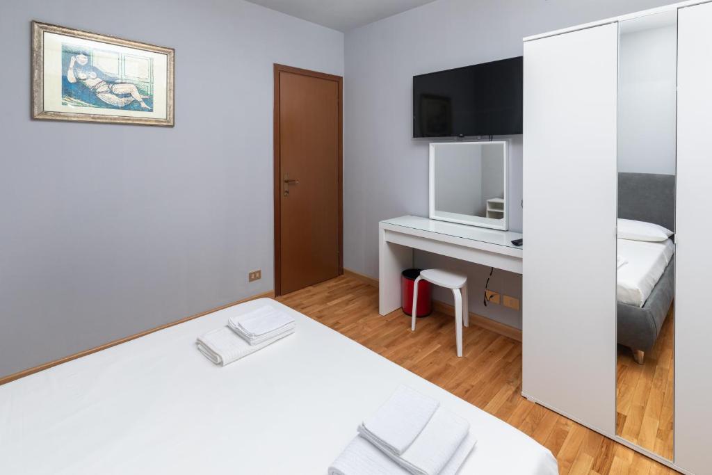Postel nebo postele na pokoji v ubytování Apartment Forum V