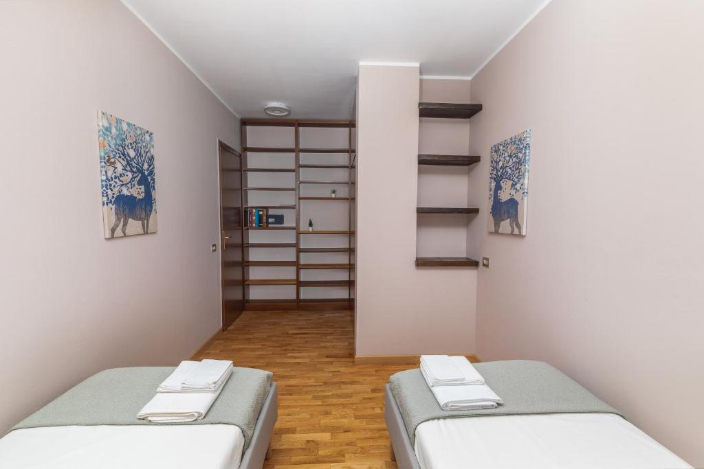 Postel nebo postele na pokoji v ubytování Apartment Forum V