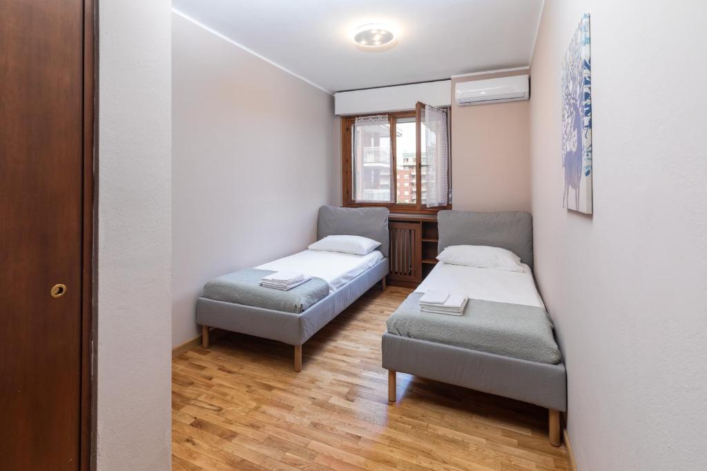 Postel nebo postele na pokoji v ubytování Apartment Forum V