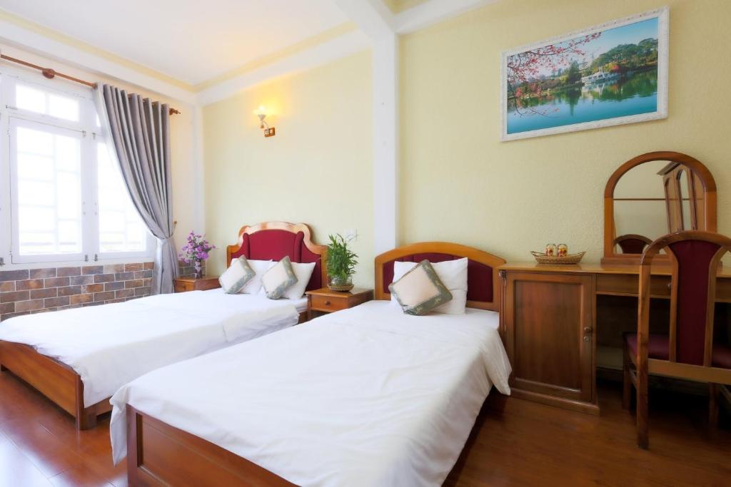 Giường trong phòng chung tại The One Home Đà Lạt