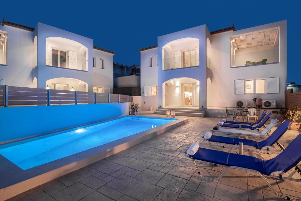 a swimming pool in the middle of a house at Splendid Zakynthos Villa - 2 Bedrooms - Ocean Pool Villa - Close to Amenities - Walking Distance to Beach in Tsilivi