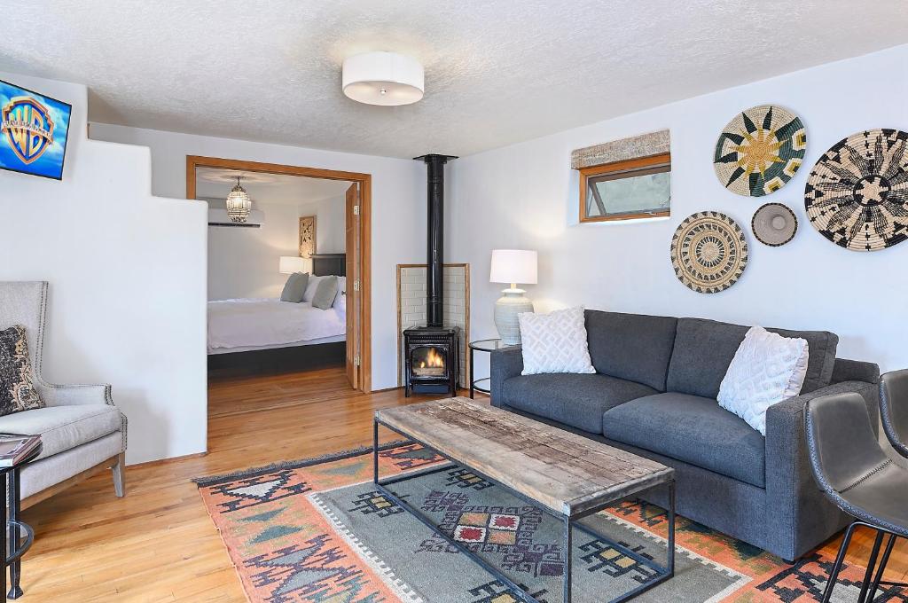 a living room with a couch and a table and a bed at Dos Hermanas 4, 5, 6 & 8 Sleeps 12 Downtown in Santa Fe