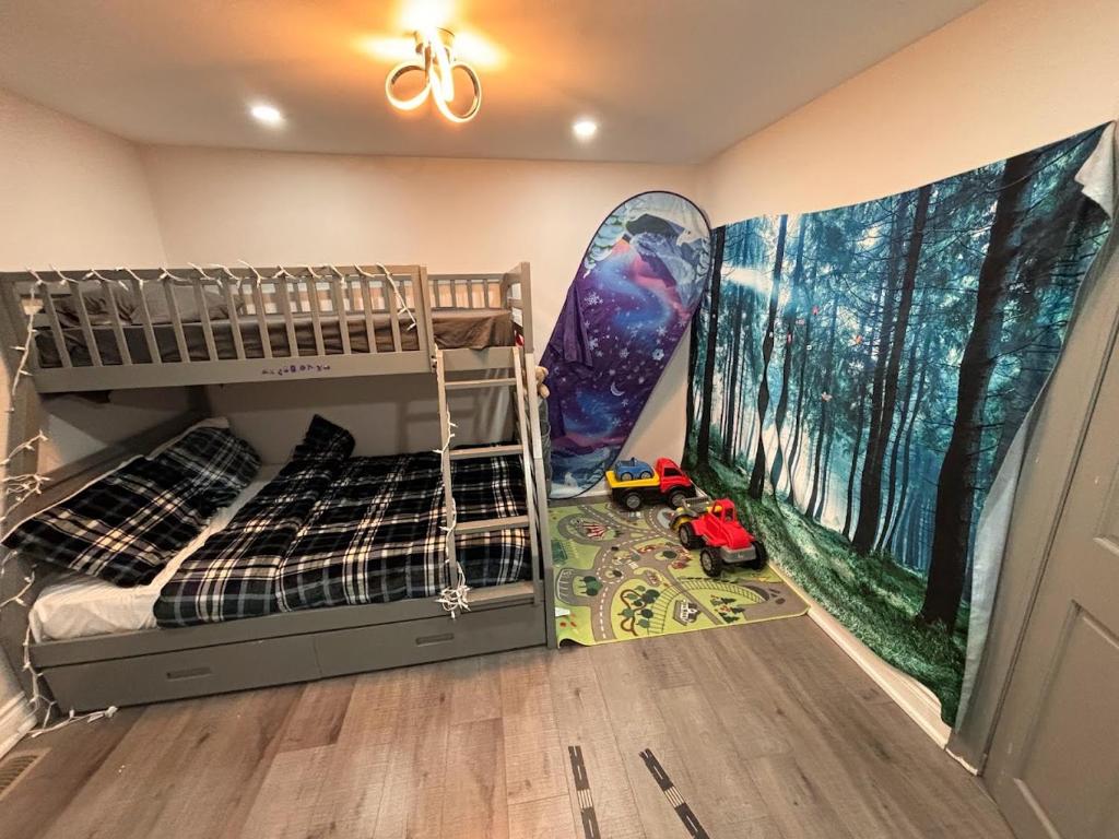 a bedroom with two bunk beds and a surfboard at House on Farm in Rosemonte