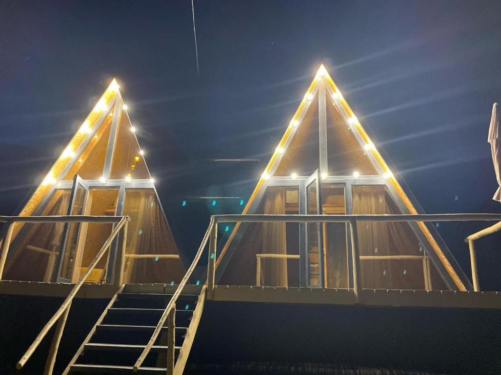 a building with a staircase with lights on it at Arevatsag Canyon Guesthouse in Alaverdi