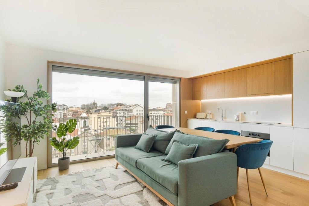 a living room with a couch and a table at GuestReady - Central Park in Porto in Porto