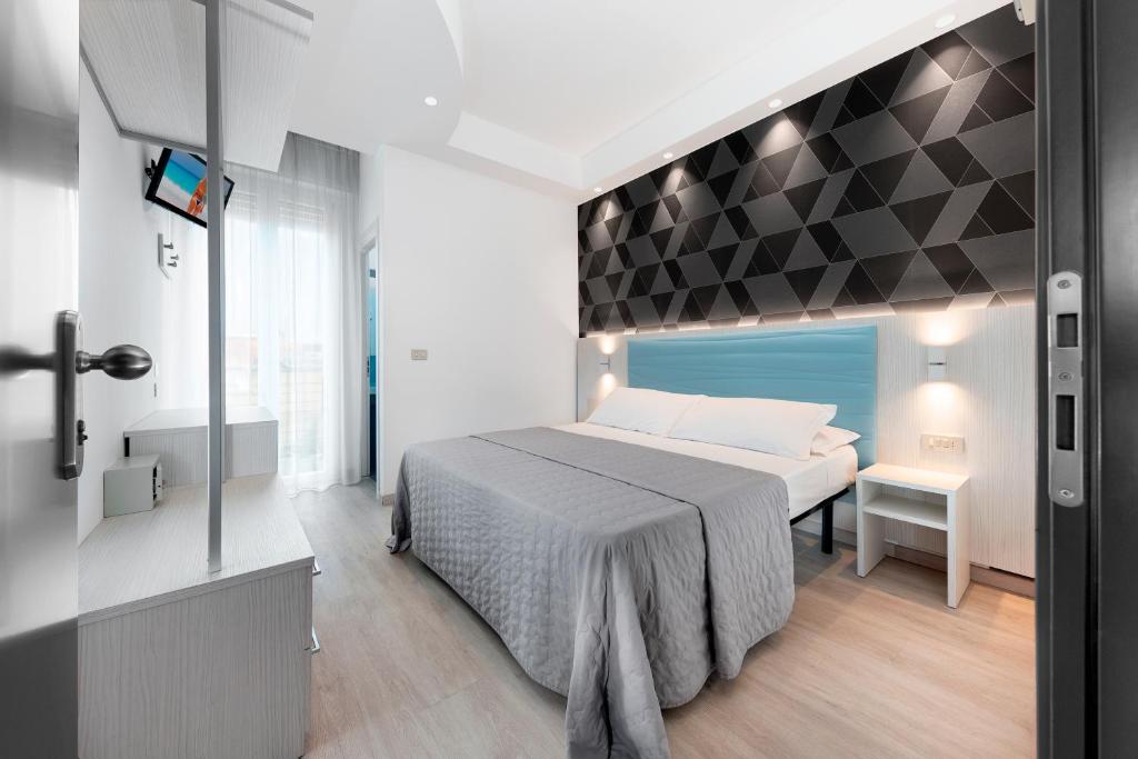 Letto o letti in una camera di Hotel Eiffel