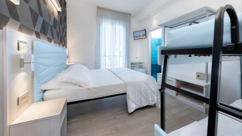 Letto o letti in una camera di Hotel Eiffel