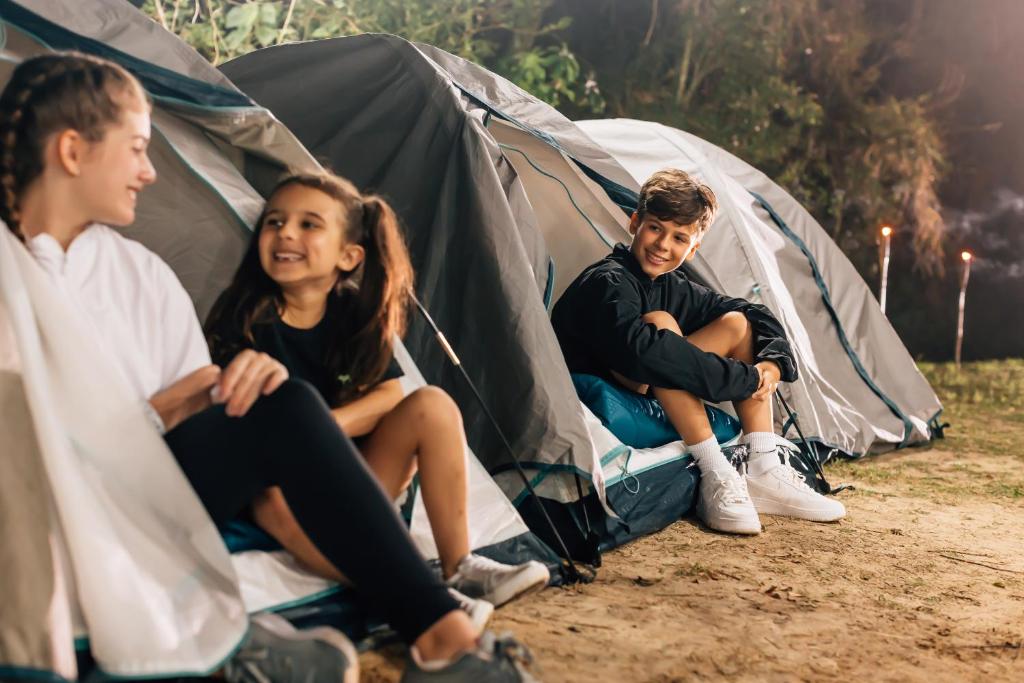 a group of children sitting in a tent at Costao do Santinho Resort All Inclusive in Florianópolis