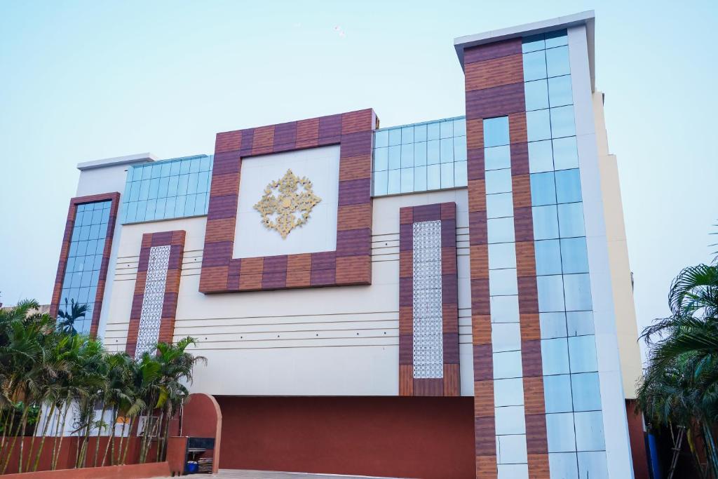 a building with a crest on the side of it at HOTEL MIDDLETON NXT in Bhubaneshwar