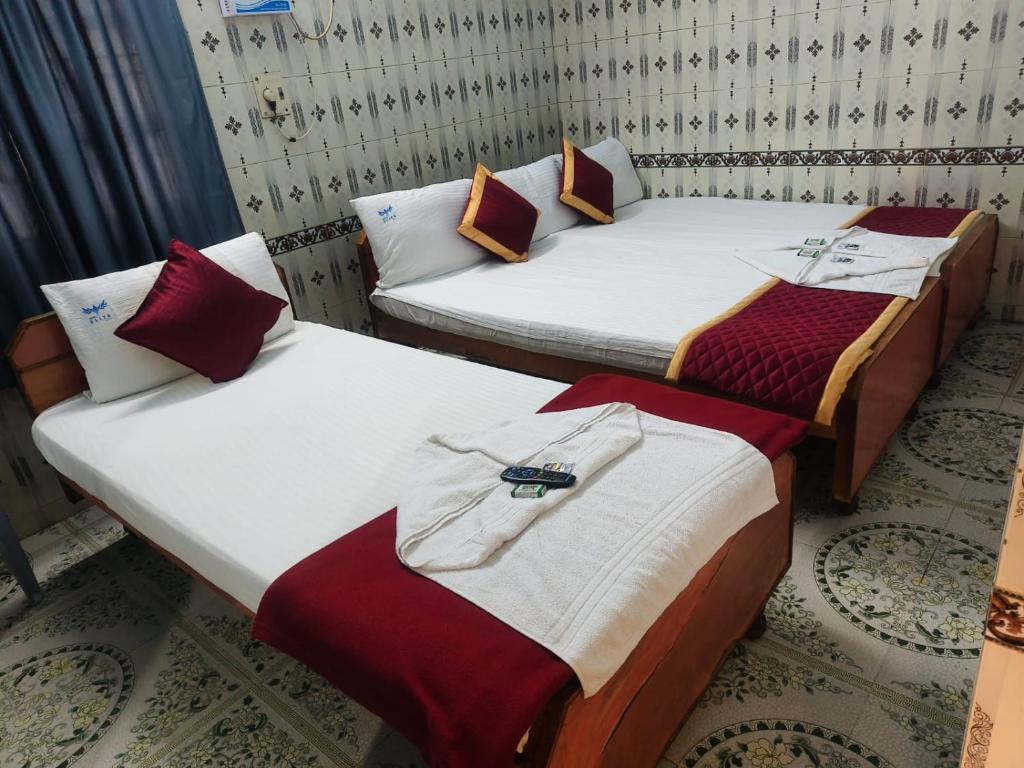 Кровать или кровати в номере Sri Kanya Residency, Srikalahasti