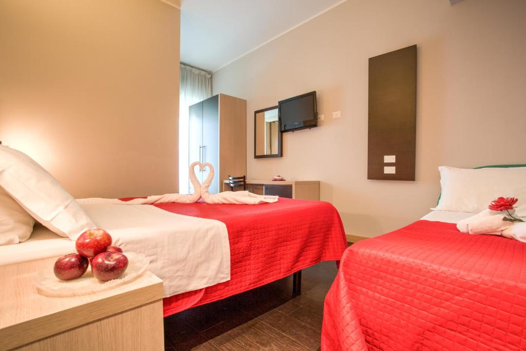 Postel nebo postele na pokoji v ubytování Hotel Aiglon
